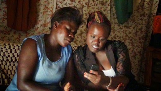 Two woman looking at phone