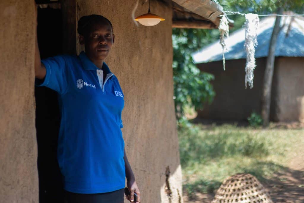 Irene outside her home